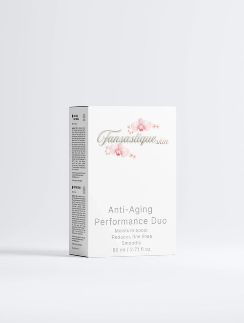 Witte verpakking van anti-aging skincare duo met orchideeën en productinformatie.
