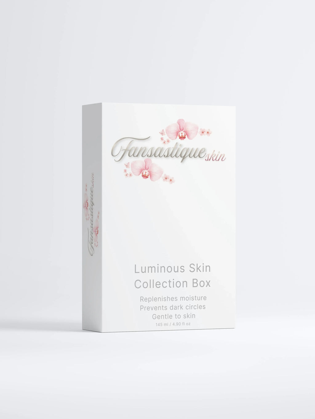 Luxe skincare set voor hydratatie en donkere kringen in witte doos met roze bloemen.