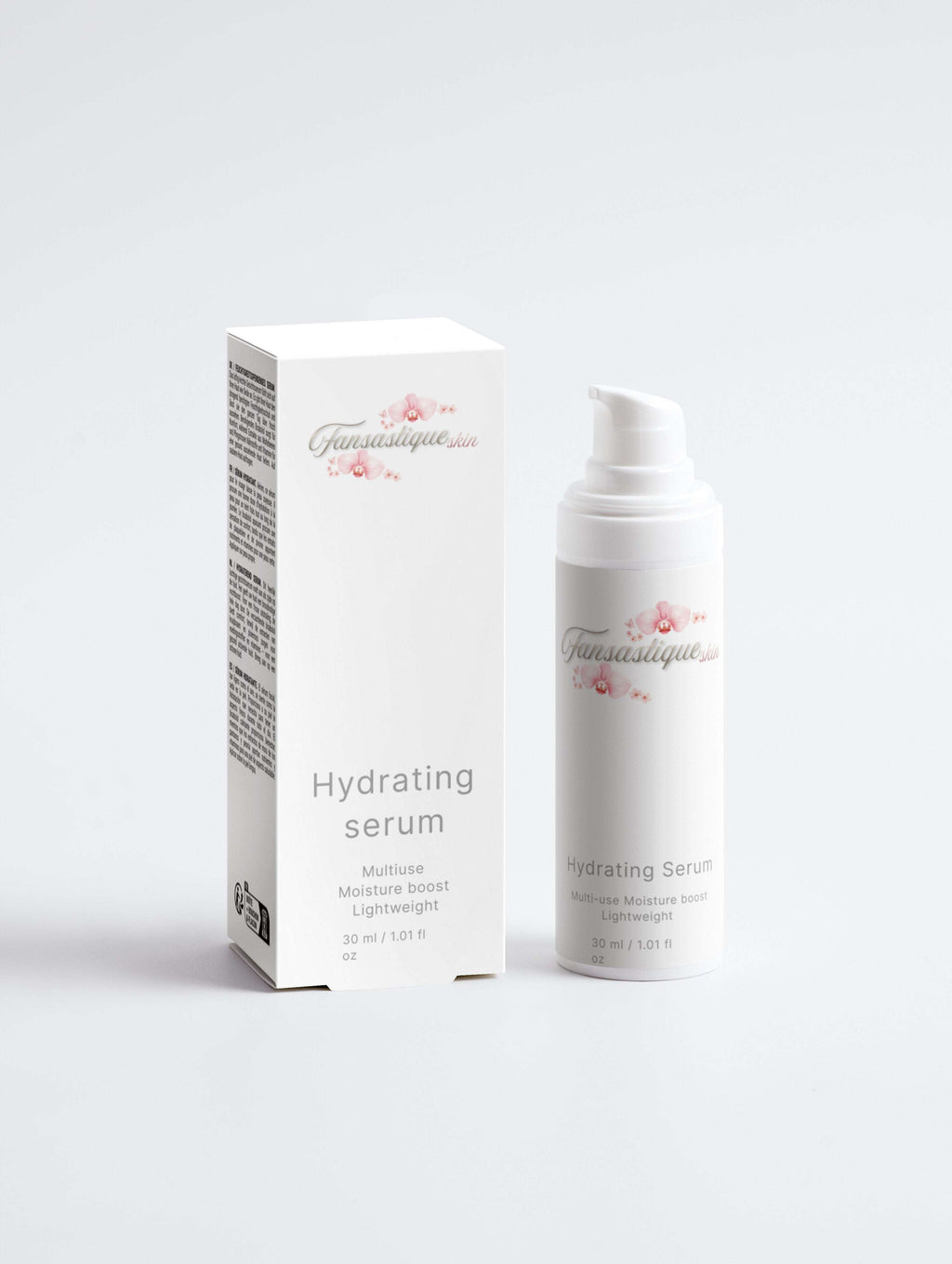 Hydraterende serum en verpakking in wit en roze voor huidverzorgingsset