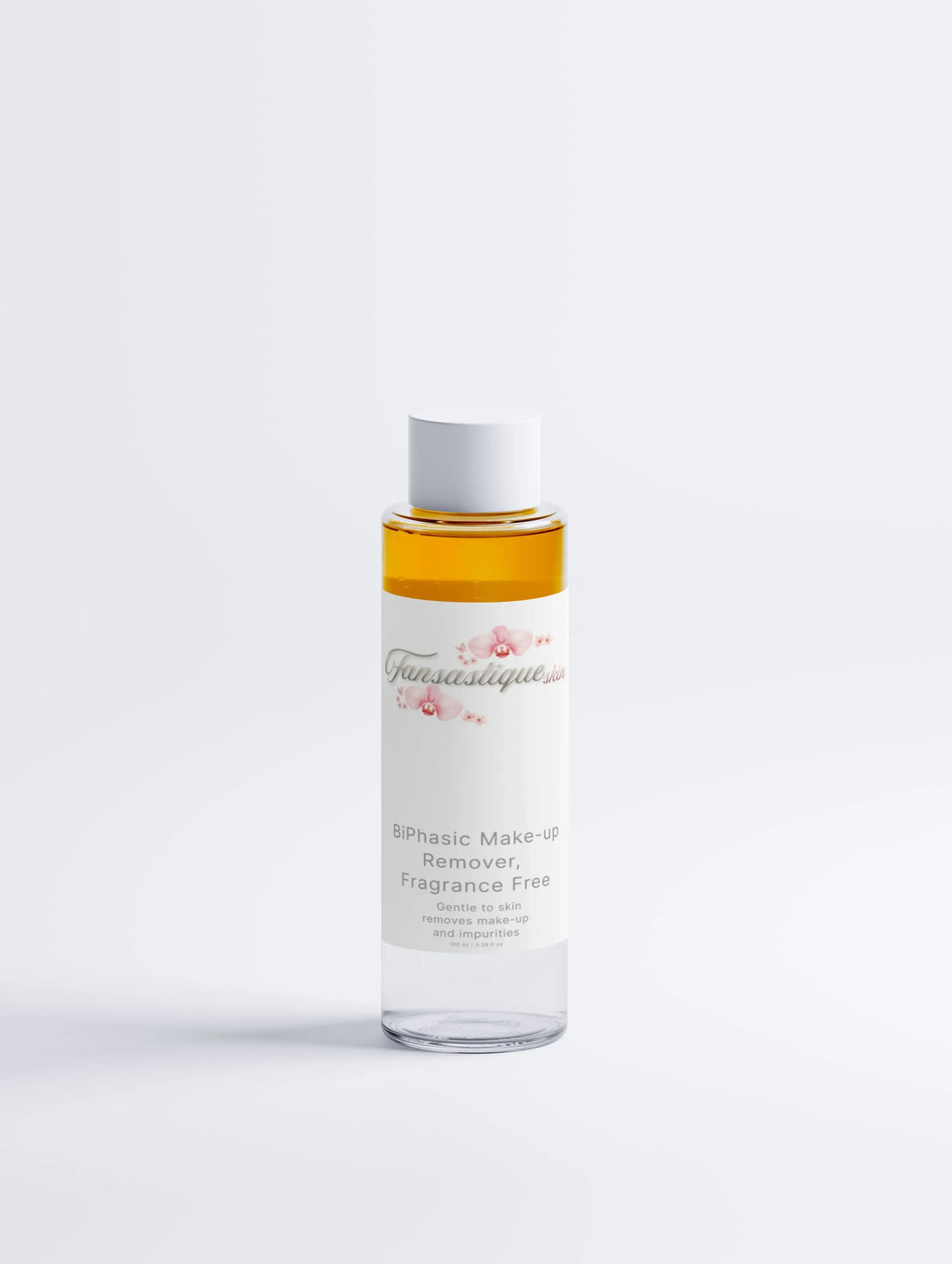 Biphasische make-up remover zonder parfum, doorzichtige fles tegen witte achtergrond